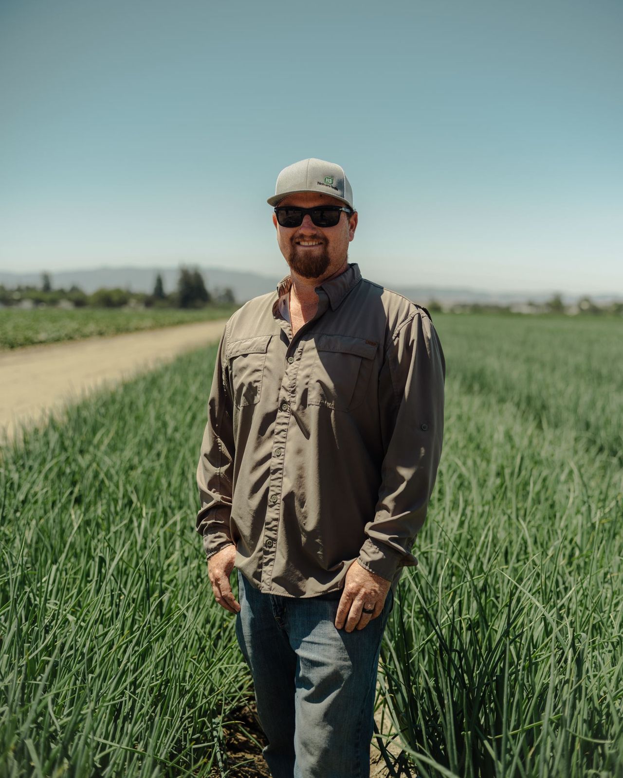 Farm owner in an onion field, California